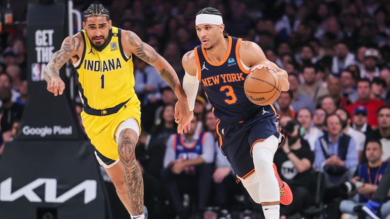 The Knicks’ Josh Hart drives past the Indiana Pacers’ Obi Toppin...
