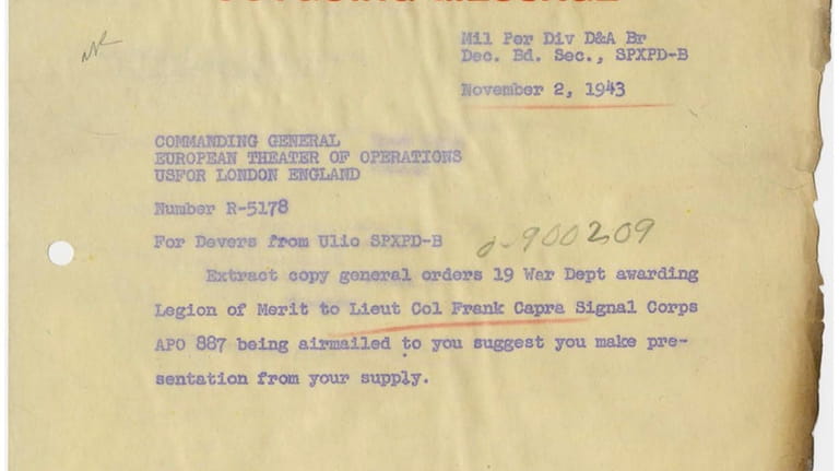 This photo provided by the National Archives shows a singed...