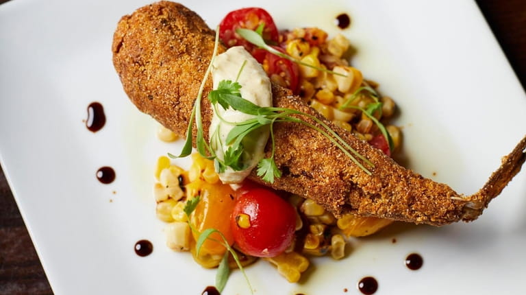 Cornmeal-crusted sea robin with an heirloom corn-tomato salad and pickled...
