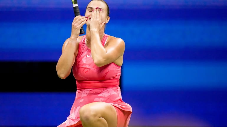 Aryna Sabalenka, of Belarus, reacts after defeating Madison Keys, of...