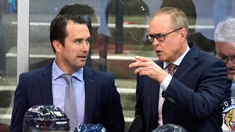 Florida Panthers head coach Paul Maurice, right, talks with assistant...