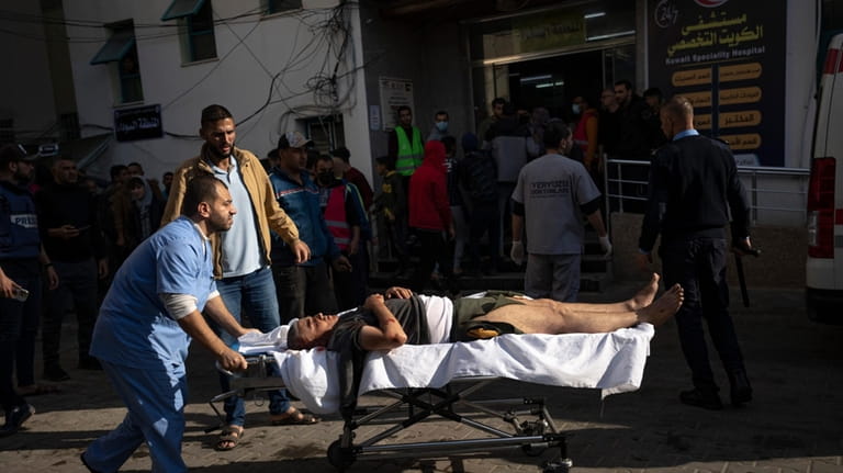 A Palestinian wounded in the Israeli bombardment of the Gaza...