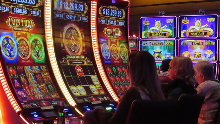 Gamblers play slot machines at the Ocean Casino Resort in...