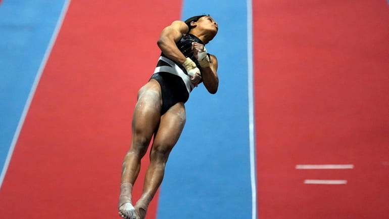 Gabby Douglas competes on the vault at the American Classic...