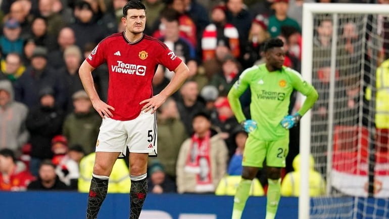 Manchester United's Harry Maguire and Manchester United's goalkeeper Andre Onan...