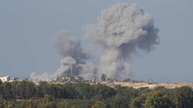 Smoke rises following an Israeli bombardment in the Gaza Strip,...