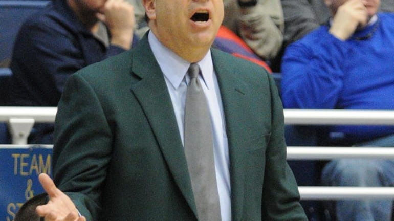 Hofstra University men's basketball head coach Tom Pecora instructs his...