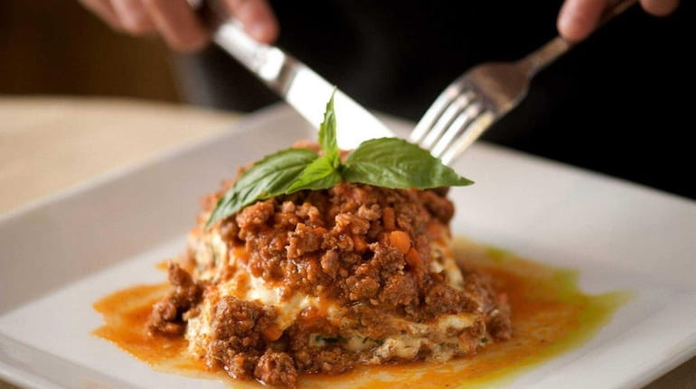 Rich, savory and meaty lasagna Bolognese served at Casa Rustica...