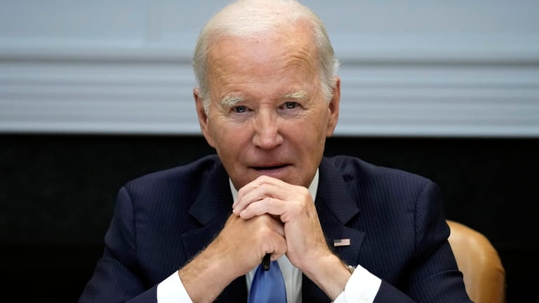 President Joe Biden listens during a meeting with the presidential...