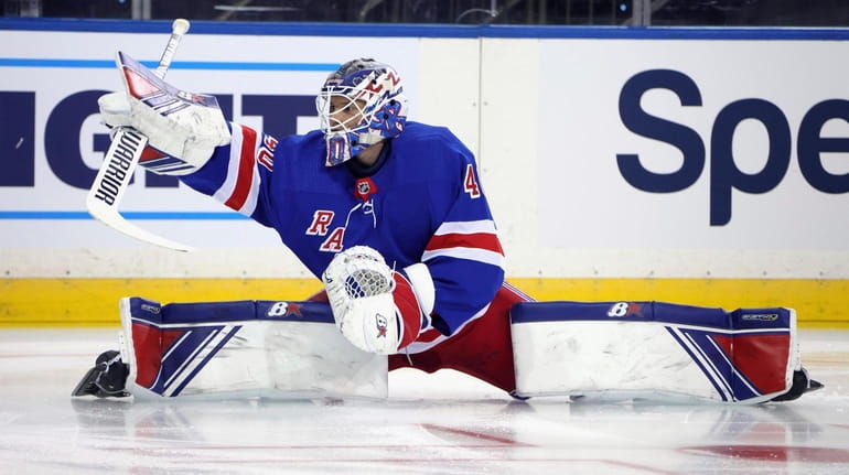 Rangers' Alexandar Georgiev stretches as players warm up for the...