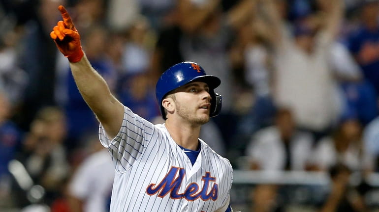 Pete Alonso #20 of the Mets reacts after his fourth...