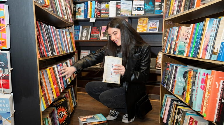 Anna Ingrilli, 23, of Cutchogue, visits Burton's Bookstore in Greenport.