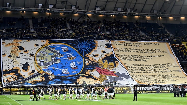 AIK's supporters hold a banner against VAR during the Allsvenskan...