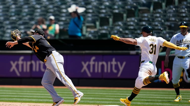 Oakland Athletics' Abraham Toro (31) reaches first base safely as...