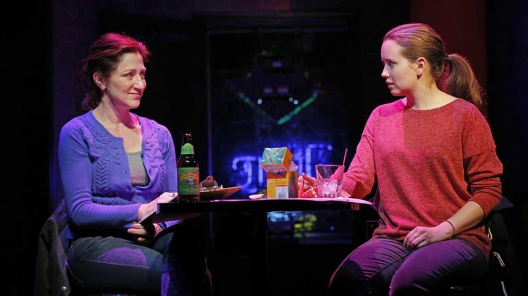 Edie Falco, left, and Phoebe Strole during a performance of...