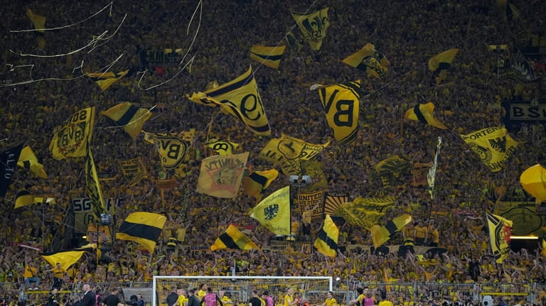 Dortmund supporters wave flags after the Champions League semifinal first...