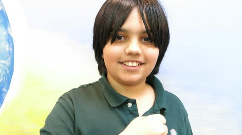 Kidsday reporter Asad Arif wears  his iRULU smart watch.