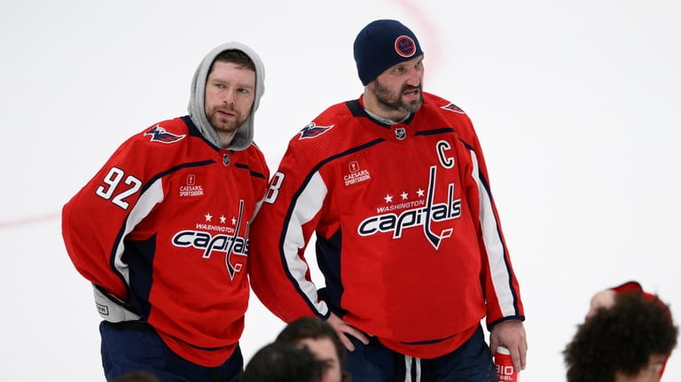 Washington Capitals left wing Alex Ovechkin (8) and center Evgeny...