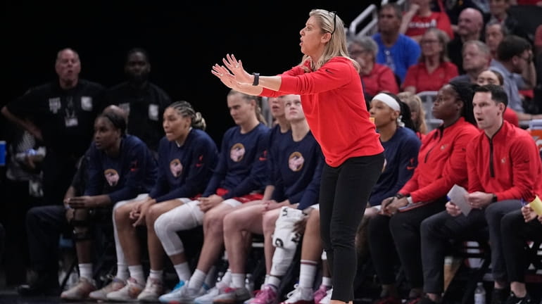 Indiana Fever coach Christie Sides gestures to players during the...