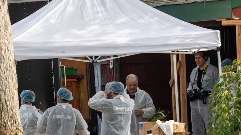 Police collect more evidence from the Massapequa park home of Gilgo Beach suspect...