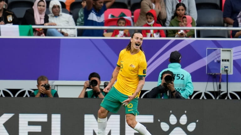 Australia's Jackson Irvine celebrates after scoring the opening goal of...