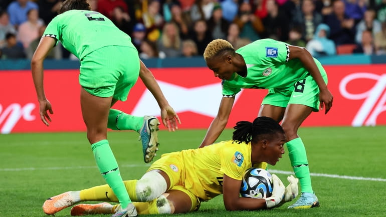 Nigeria's goalkeeper Chiamaka Nnadozie saves a ball during the Women's...