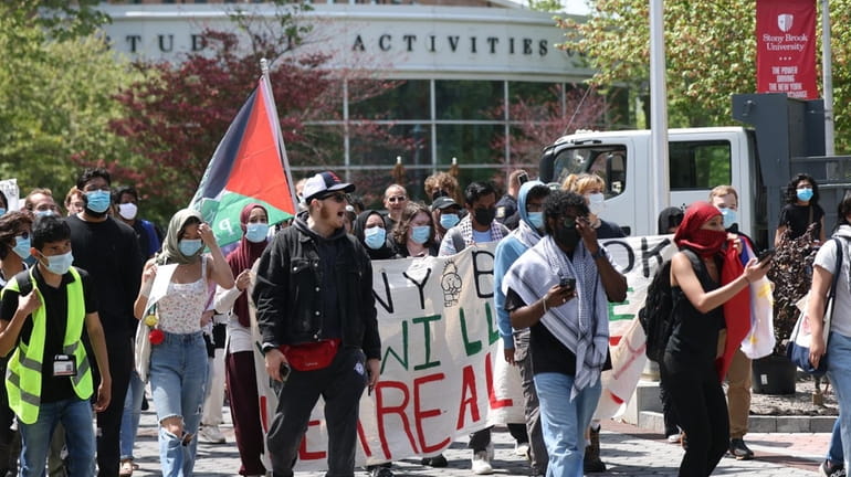 Protesters march on campus at Stony Brook University on Wednesday.