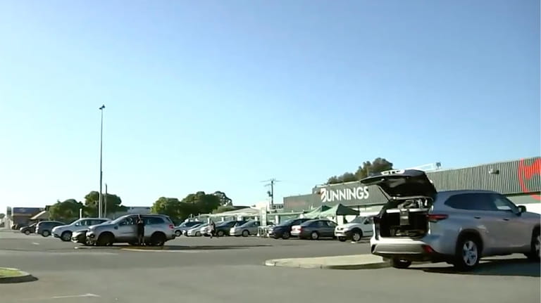 This image from a video, shows a parking lot where...