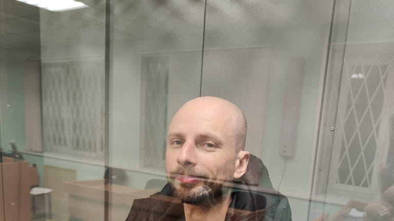 Russian journalist Sergey Karelin appears in court in the Murmansk...