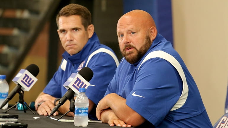 Giants head coach Brian Daboll, right, and general manager Joe...