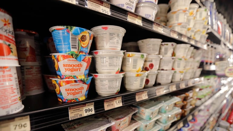 Yogurt is displayed for sale at a grocery store in...