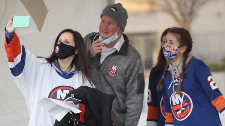 Fans arrive for the game between the Islanders and the Devils...