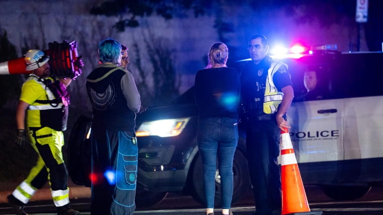 Neighborhood residents speak to Austin Police officers in Austin, Texas...