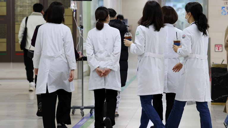 Medical workers walk inside a general hospital in Gwangju, South...