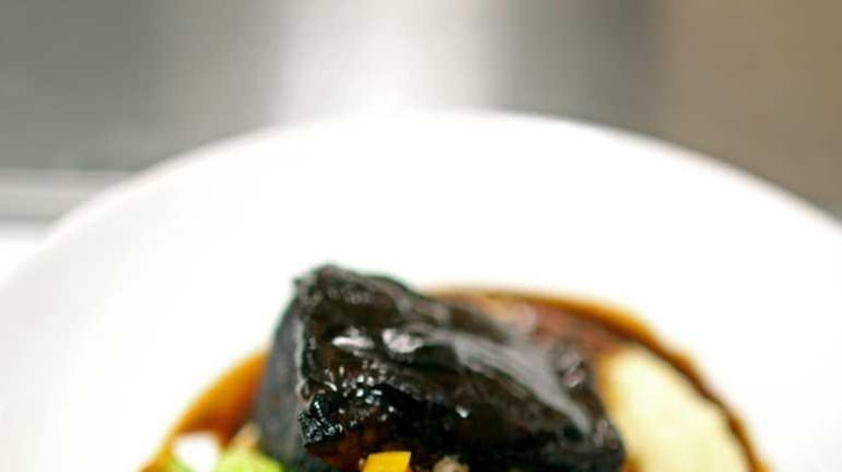 A braised Niman Ranch short rib comes with garlicky whipped...