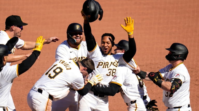 Pittsburgh Pirates' Edward Olivares (38) celebrates after hitting a walkoff...
