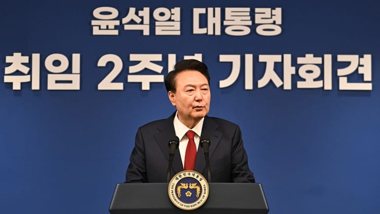 South Korean President Yoon Suk Yeol attends a press conference...