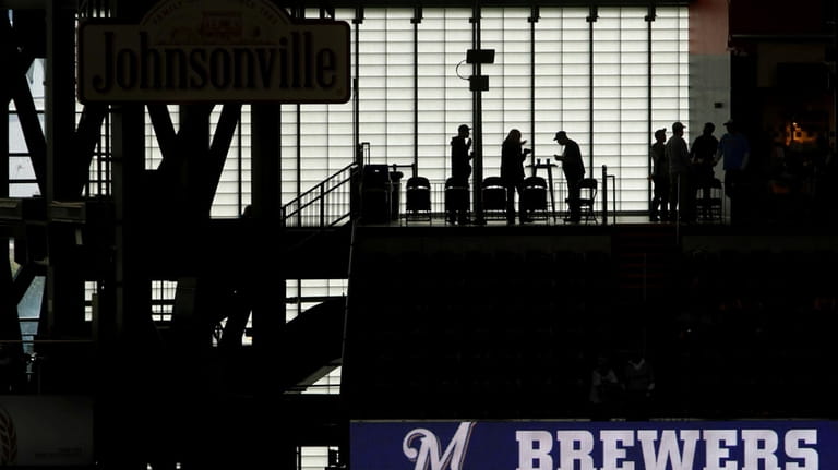 Fans arrive at Miller Park before Game 2 of the...