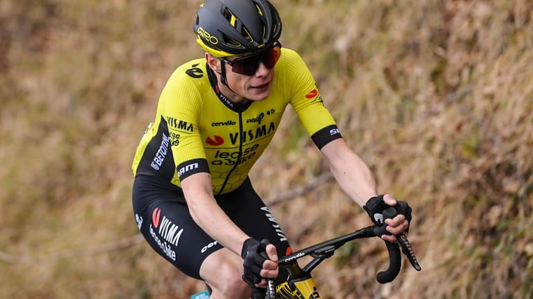 Denmark's Jonas Vingegaard pedals on his way to win the...