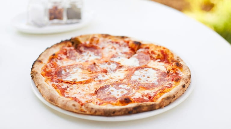 Salsiccia pizza with soppressata, house-made mozzarella, pomodoro and hot honey...