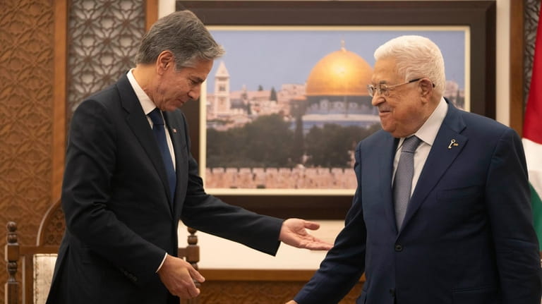 Palestinian President Mahmoud Abbas, right meets with U.S. Secretary of...