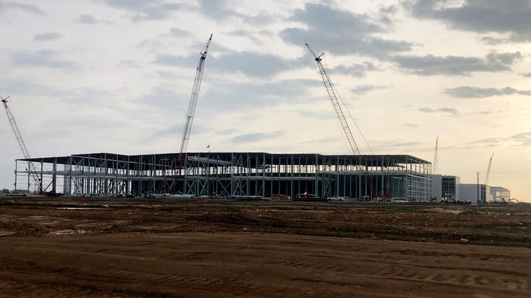Construction continues on a battery plant, part of a $5.6...