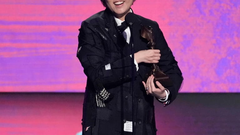 Celine Song accepts the award for best director for "Past...