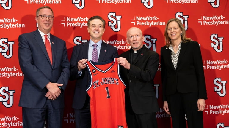 From left, St. John's Athletic Director Michael Cragg, new head coach...