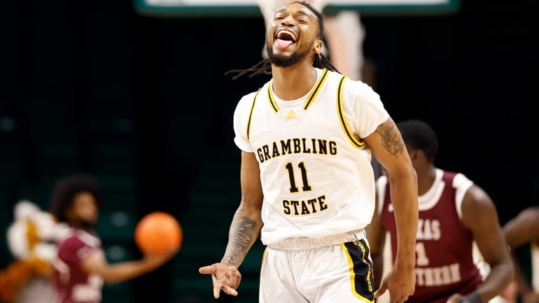 Grambling State guard Jourdan Smith (11) reacts after making a...