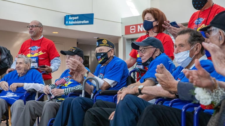 World War II veterans gather for their honorary flight to...