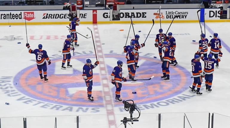 Islanders celebrate their Game 6 overtime victory in the Stanley...