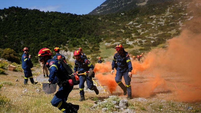 Firefighters of the 1st Wildfire Special Operation Unit, take part...