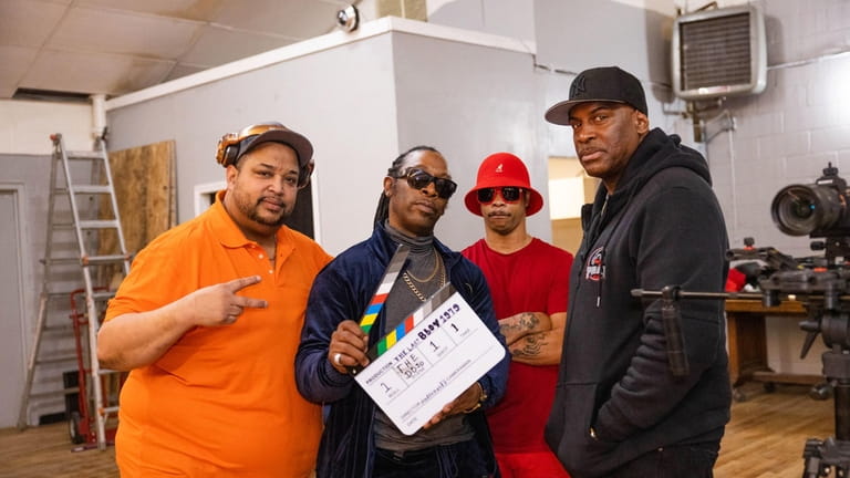Filmmaker Andre Guilty, second from left,with cinematographer Shawn Davis of Freeport; rapper-actor...