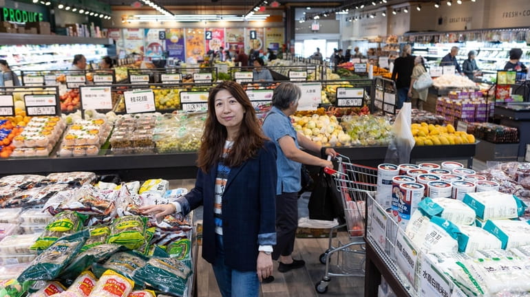 Emma Lu, co-owner of Shop Fresh, an Asian grocery store...